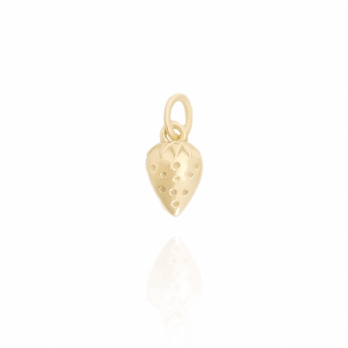 Gold pendant on a white background